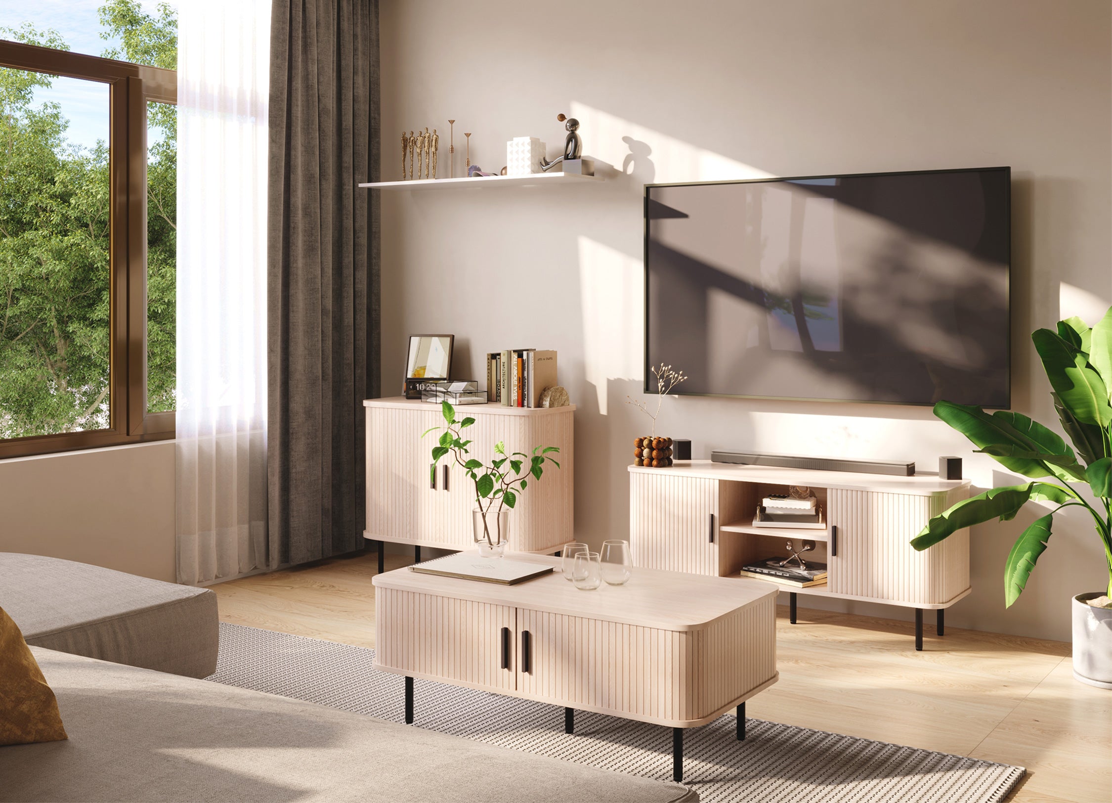 Modern living room with a television and decorative items.