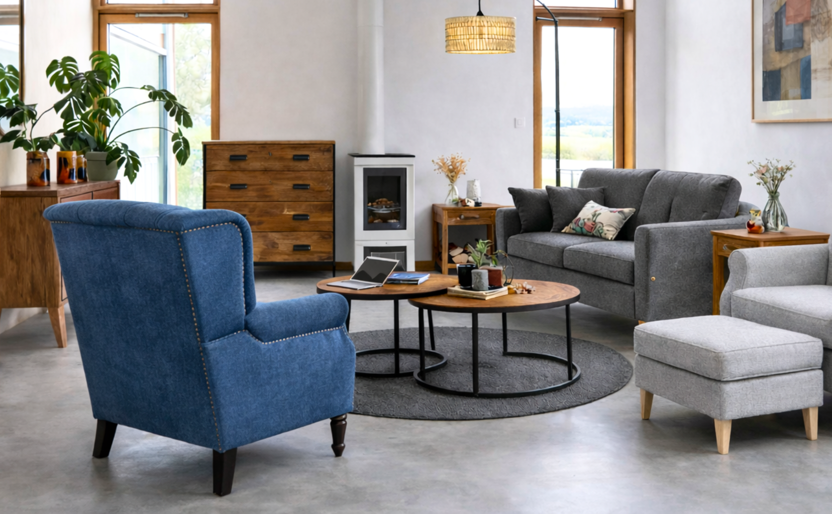 Modern living room with a blue armchair, gray sofa, and wooden coffee table.