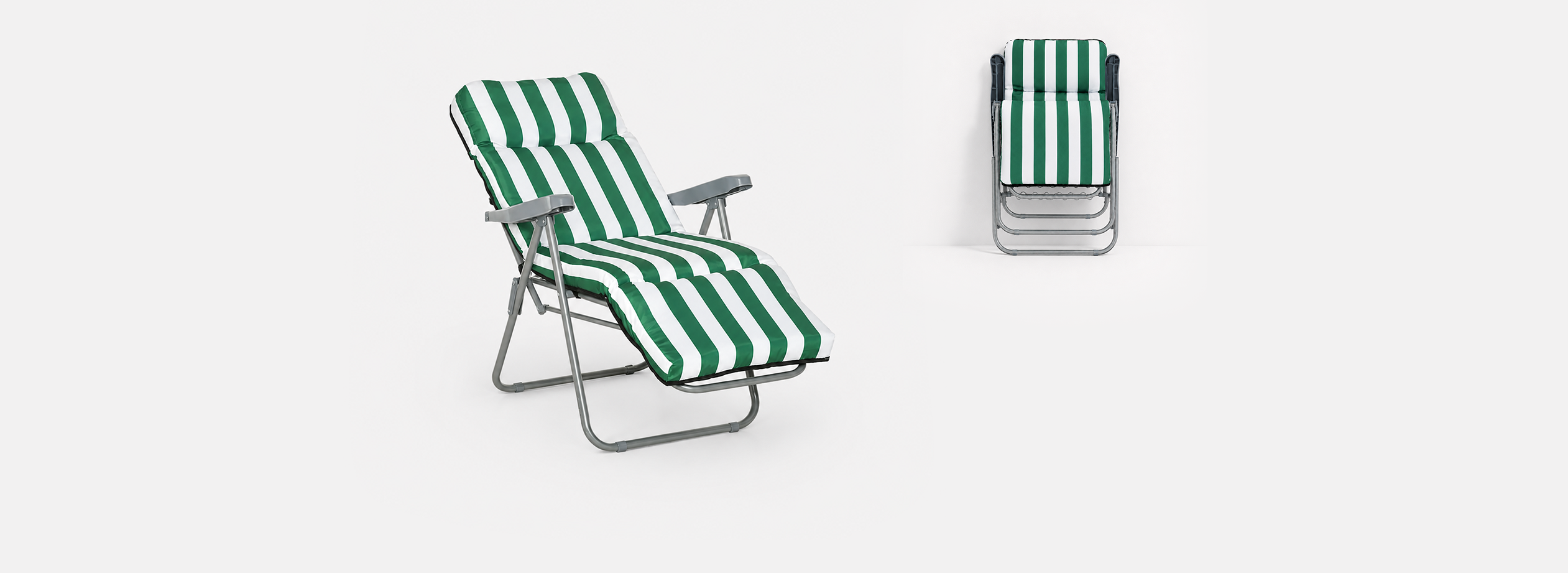 Green and white striped folding chair on a white background