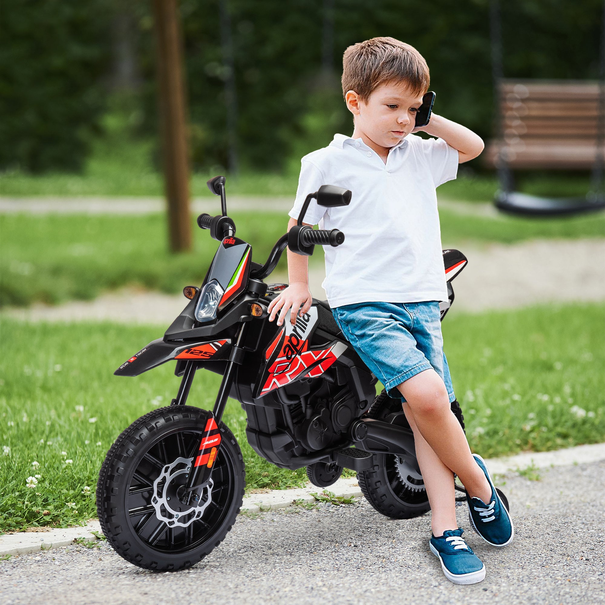 Kids Electric Motorcycle cross bike for children under Aprilia license with 2 12V motors, max speed 6 km/h, training wheels, spring suspension, LED light, music, USB - red