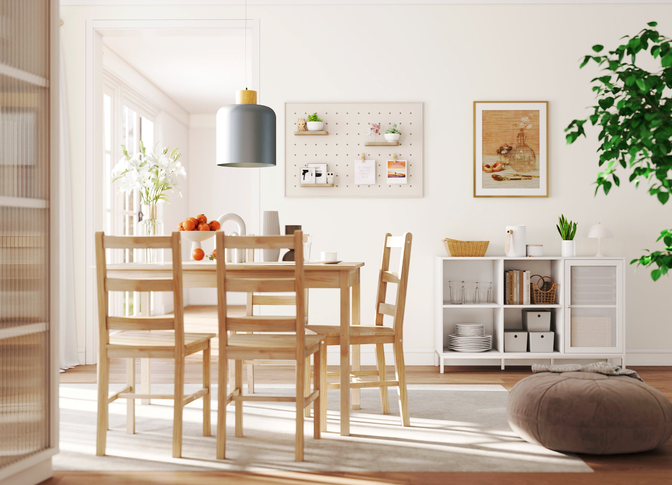 Dining area with wooden table and chairs in a bright room with white walls and a plant.