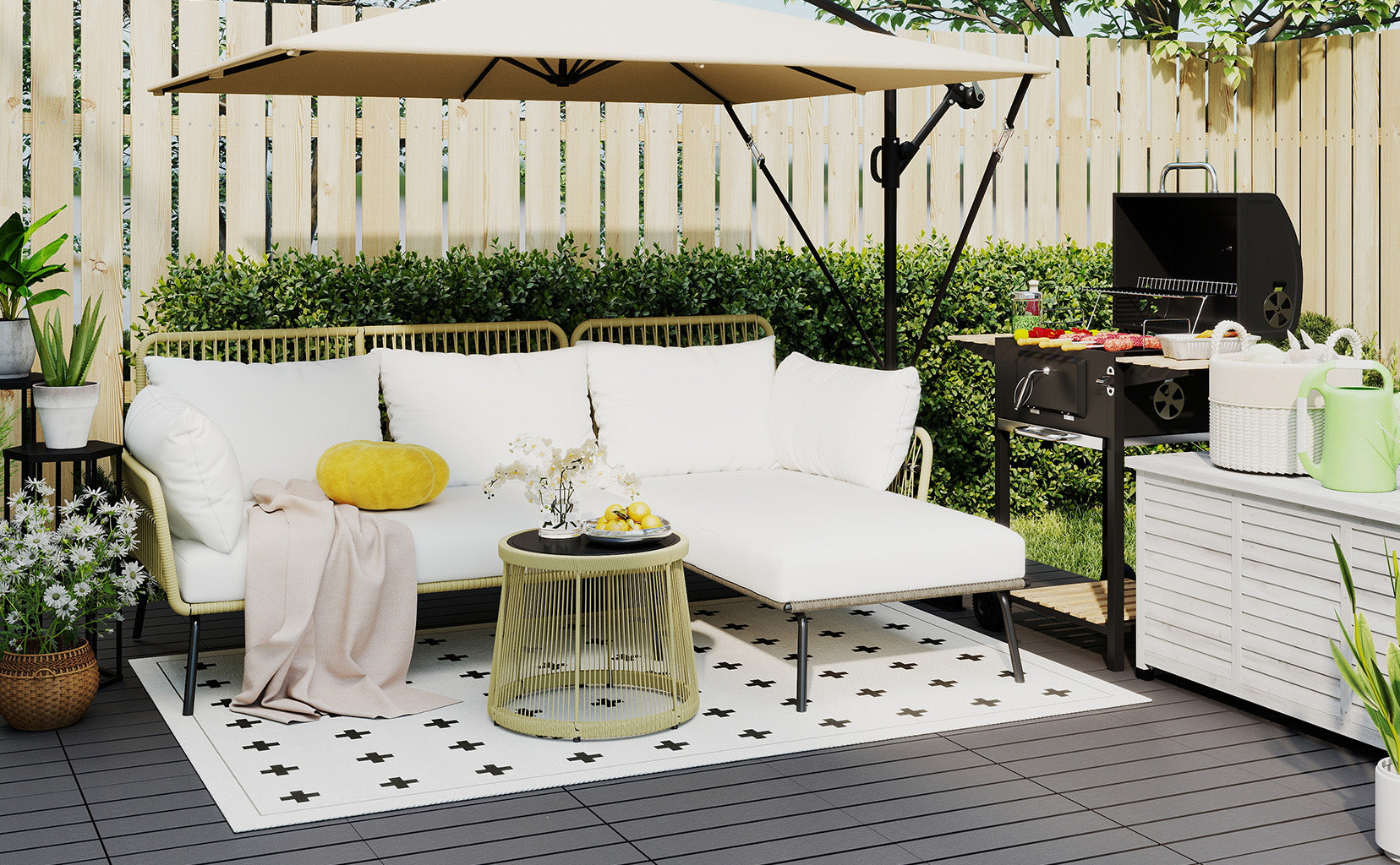 Outdoor patio with white sofa, umbrella, small table, and grill area.