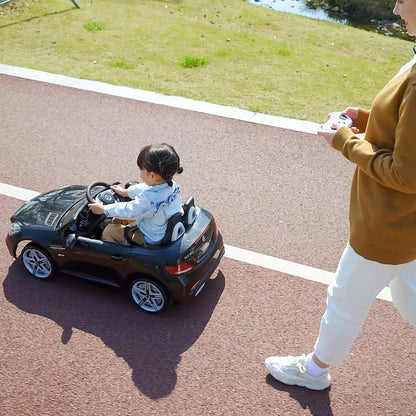 12 V Kids Electric Car, Children's Vehicle with 2.4G Remote Control, Electric Vehicle with LED Headlights, Seatbelt, Horn, Music, Mercedes SLC 300 Kids Car for Kids from 3 Years, Black