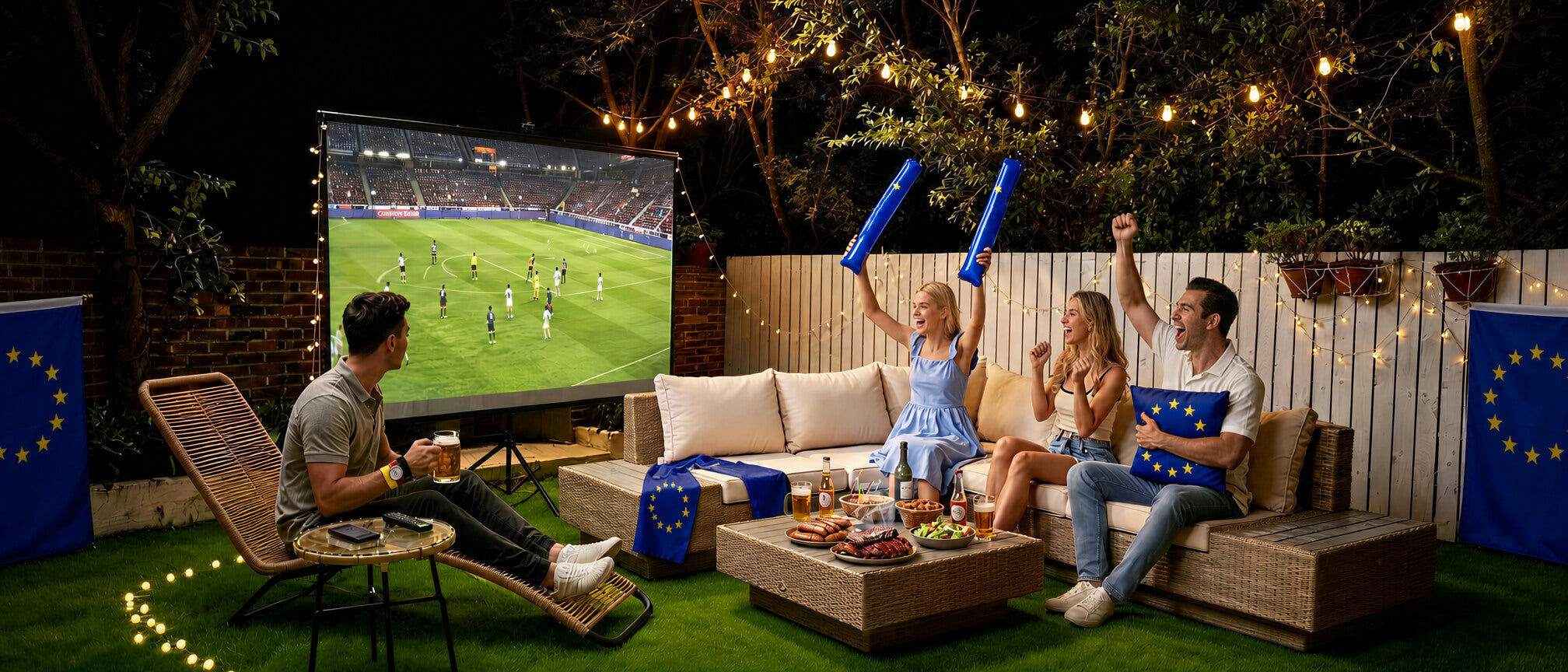 Family watching a sports game on a large outdoor screen in a backyard setting.